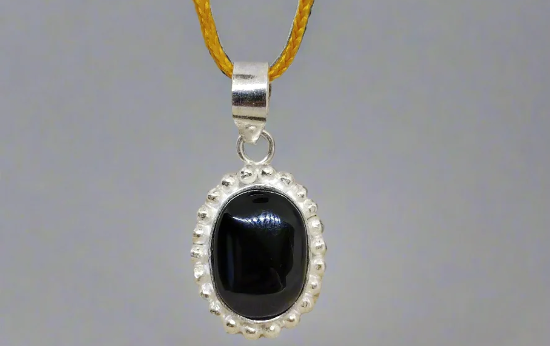 Manufacturer, Exporter, Importer, Supplier, Wholesaler, Retailer, Trader of Black Haqik Pendant in New Delhi, Delhi, India.