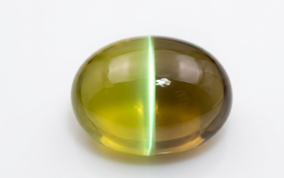 Manufacturer, Exporter, Importer, Supplier, Wholesaler, Retailer, Trader of Cats Eye Gemstone in New Delhi, Delhi, India.