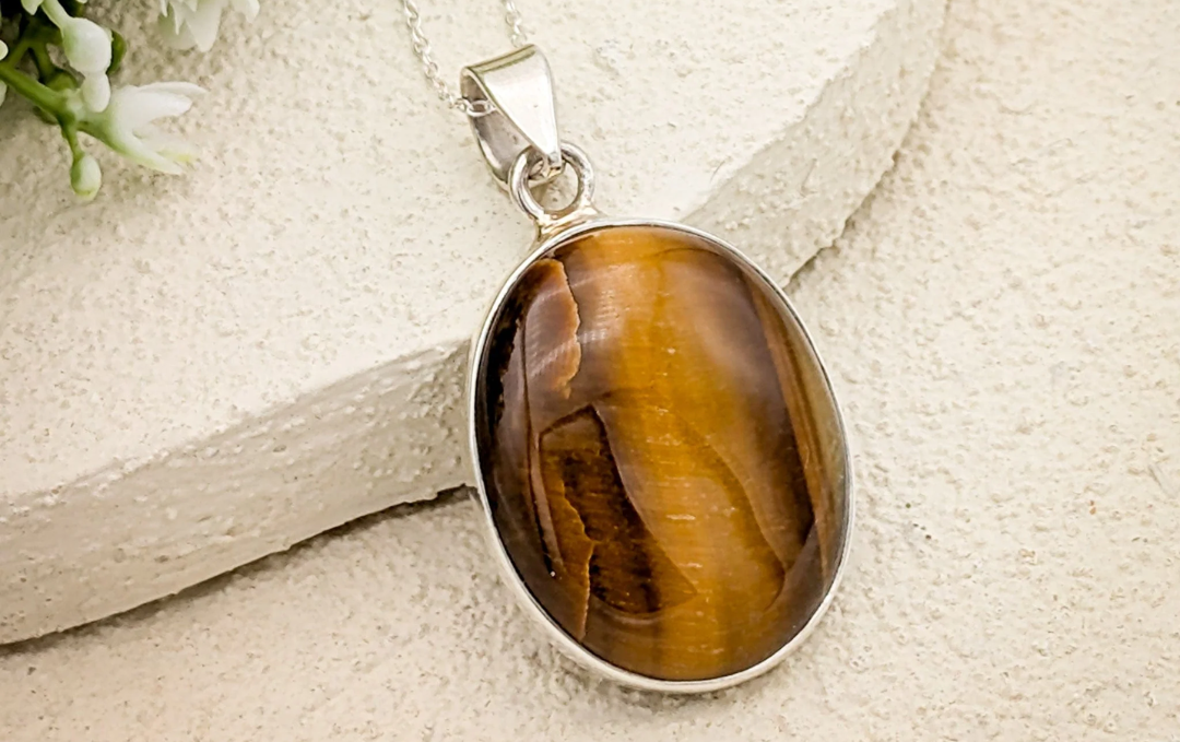 Manufacturer, Exporter, Importer, Supplier, Wholesaler, Retailer, Trader of Tiger Eye Pendant in New Delhi, Delhi, India.